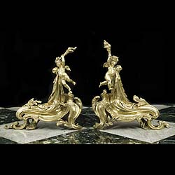 An Antique pair of Rococo style brass Chenets/Fire Dogs 