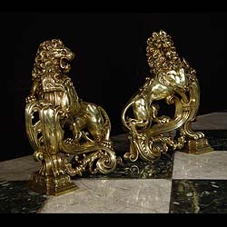 A pair of burnished brass lion antique andirons   