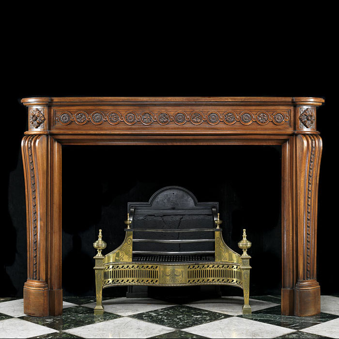A Louis XVI Carved Walnut Fireplace Mantel
