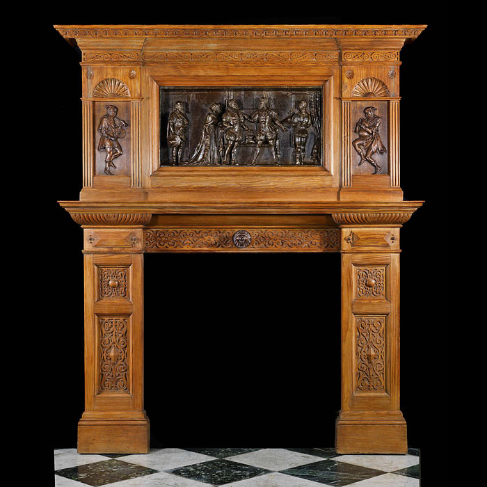 Antique carved Oak Arts and Crafts fireplace in a Tudor Gothic manner


