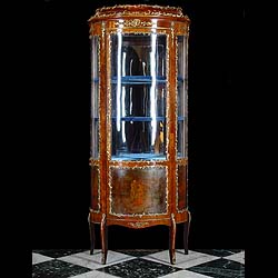 A Louis XV Rococo style Vitrine in Glass and Gilt metal
