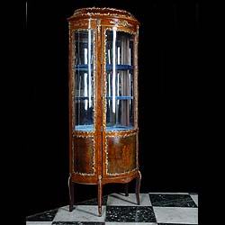 A Louis XV Rococo style Vitrine in Glass and Gilt metal
