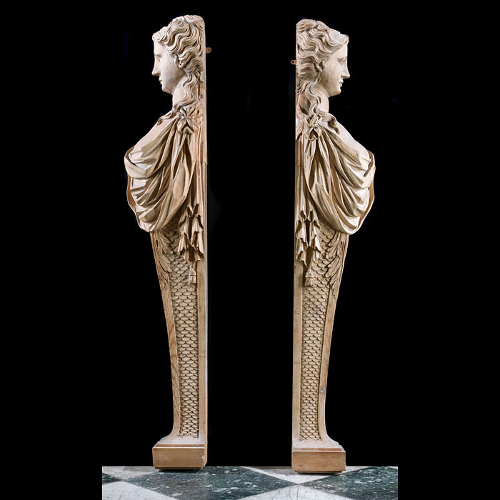A Neoclassical pair of large, pine caryatid