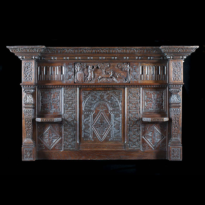 An antique Jacobean style carved oak overmantel 