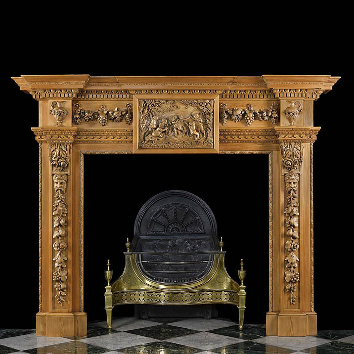 Antique Carved Pine and Limewood Fireplace in a Palladian style with decorative Putti 


