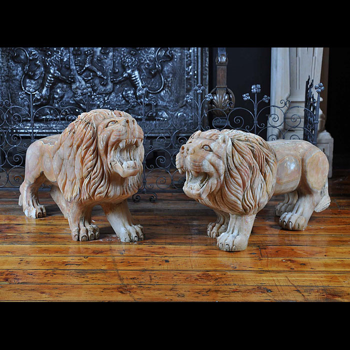 A fine pair of chalcedony lions passant