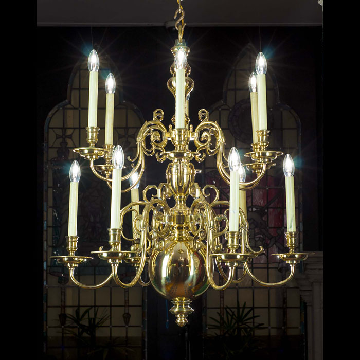 A 20th century 12 branch brass Baroque style chandelier