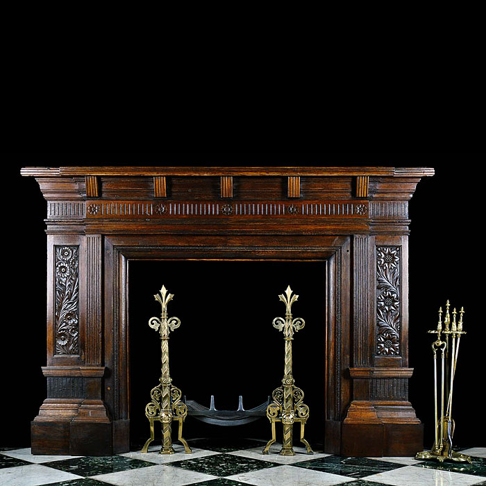 A Carved Oak Arts and Crafts style Chimneypiece 
