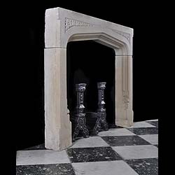 A Jacobean style antique stone fireplace surround    