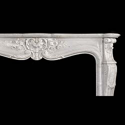 An antique Louis XV Rococo style statuary marble fireplace surround