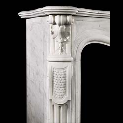 An antique Louis XV Rococo style statuary marble fireplace surround