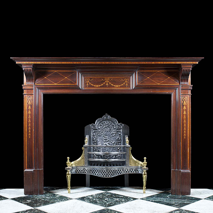 An Antique Edwardian Mahogany and Satinwood fireplace mantel