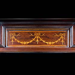 An Antique Edwardian Mahogany and Satinwood fireplace mantel