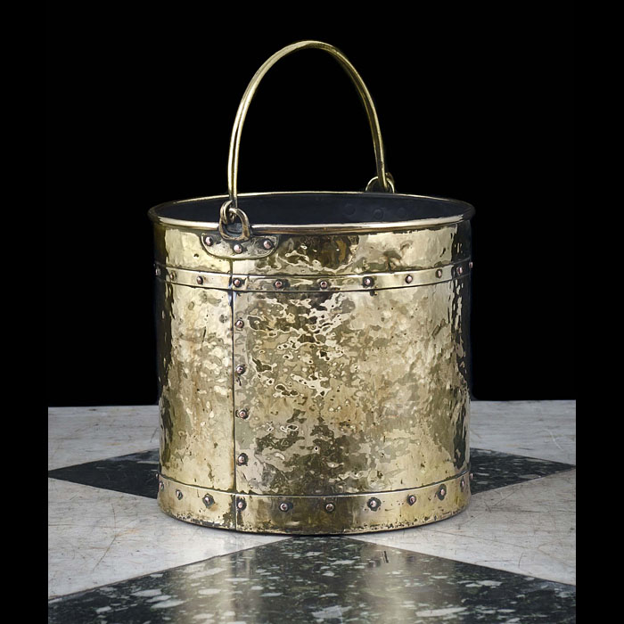  A 20th century hammered brass coal bucket   