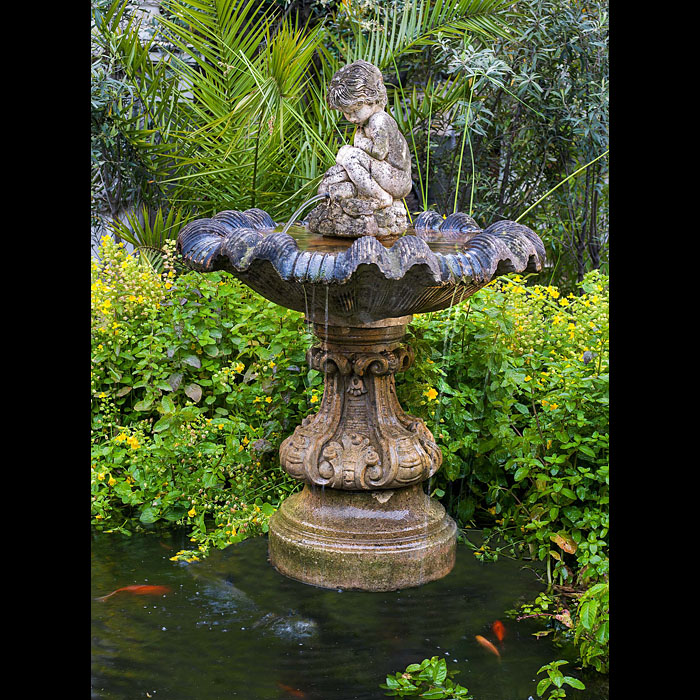 An Italian style 20th century composition stone fountain