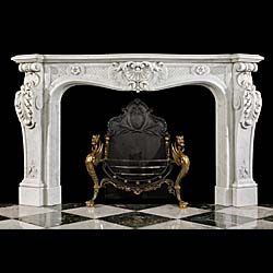 An antique Louis XV Carrara Marble chimneypiece