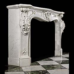 An antique Louis XV Carrara Marble chimneypiece