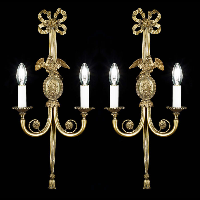 A pair of Georgian style antique brass wall lights 