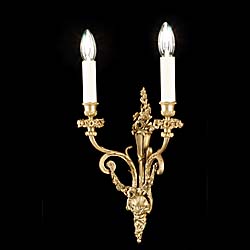 A pair of antique brass Regency style wall lights
