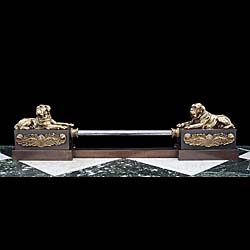  An antique bronze, steel & gilt brass Empire style fireplace fender. 