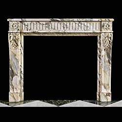 An Antique Louis XVI Pavonazzetto marble fireplace surround