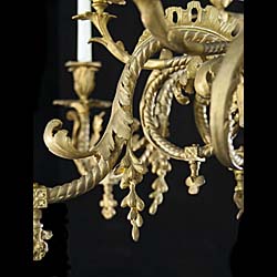 A 19th century antique 12 branch brass Rococo style chandelier