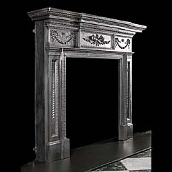 An Antique neoclassical style fireplace surround