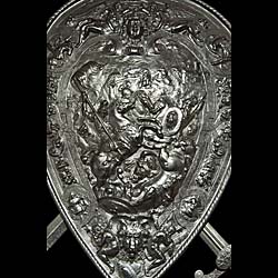 A late 19th century embossed cast iron antique shield of Henry II of France