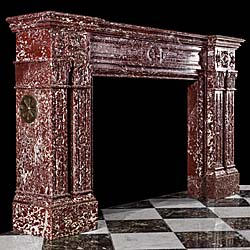 A Palladian style marble antique fireplace mantel in Rouge Languedoc Marble