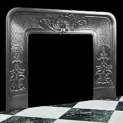  An antique cast iron Louis XVI style fireplace insert