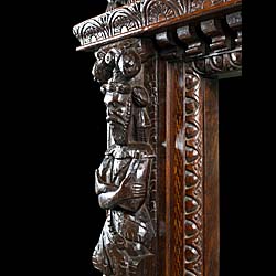 A Wide Carved Oak Jacobean Style Fireplace