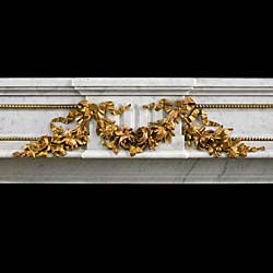An antique Louis XVI style statuary marble and gilt bronze mounted Fireplace surround 