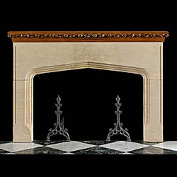 A Tudor Gothic style antique carved stone antique chimneypiece 