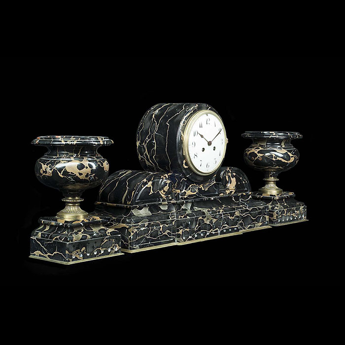 A neoclassical style antique mantelpiece clock and twin vase set