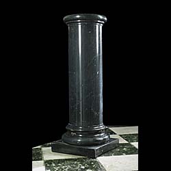 A 20th century black marble column