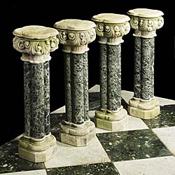 A set of four antique stone and marble cluster columns  
