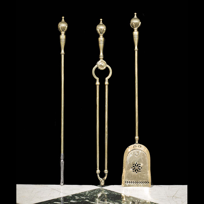 An Antique set of three Victorian brass fire tools 