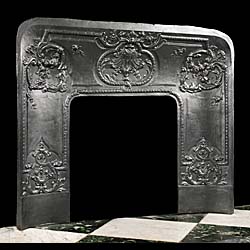 A French antique cast iron fireplace insert