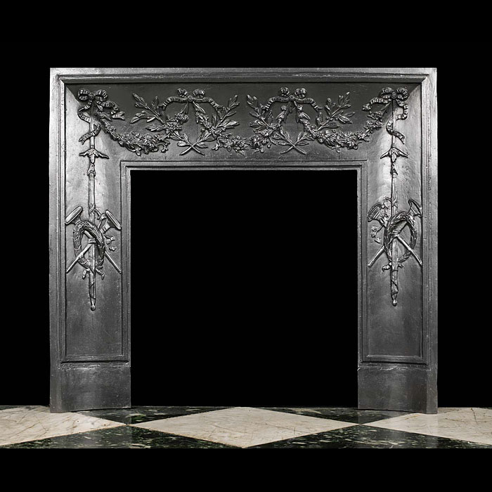 An antique Victorian fireplace insert in the Louis XVI style