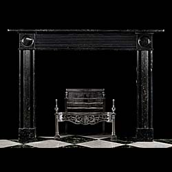 A Regency Black Fossil Marble Fireplace