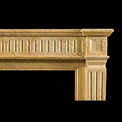 An antique Regence style marble fireplace surround