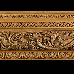 A carved pine antique fireplace mantel in the manner of George II.