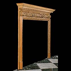  A carved pine antique fireplace mantel in the manner of George II.