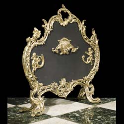 An attractive 20th century Rococo style brass & mesh firescreen