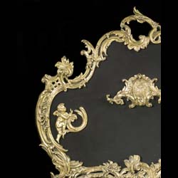 An attractive 20th century Rococo style brass & mesh firescreen