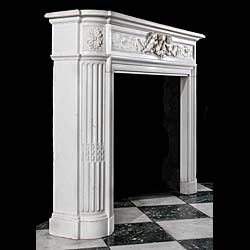 An English Louis XVI style chimneypiece in white statuary marble. 