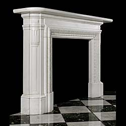 An Antique white statuary marble Regency style fireplace surround 