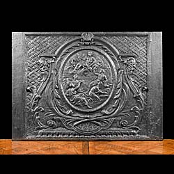 A 17th century large antique French cast iron fireback.