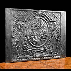 A 17th century large antique French cast iron fireback.