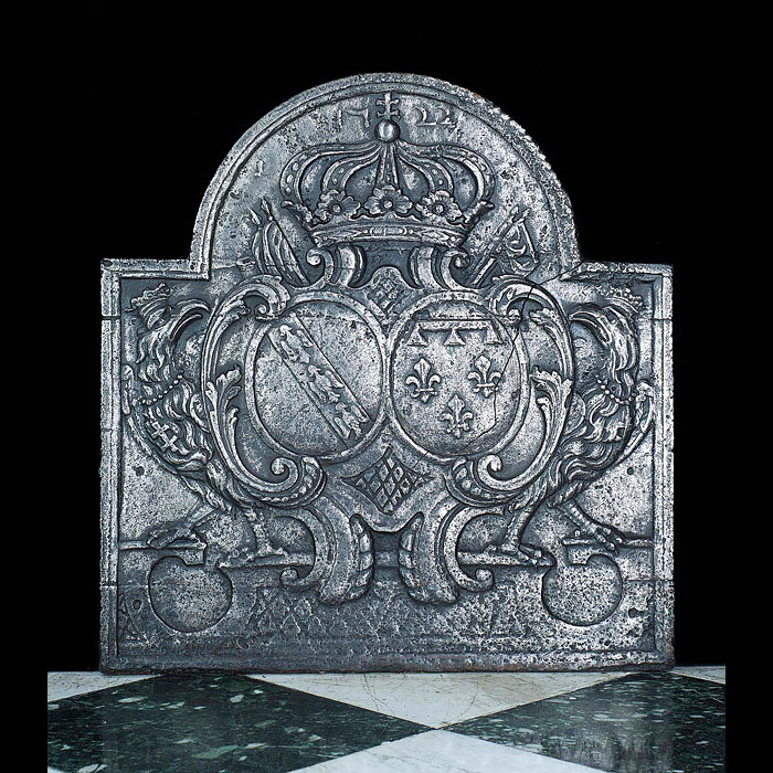 A cast iron antique 1722 Anjou fireback